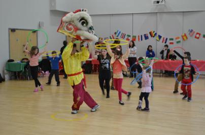 Chinese Dragon Dance performance during the 1000th Homes event, Trumpington Meadows school hall, 25 January 2015.