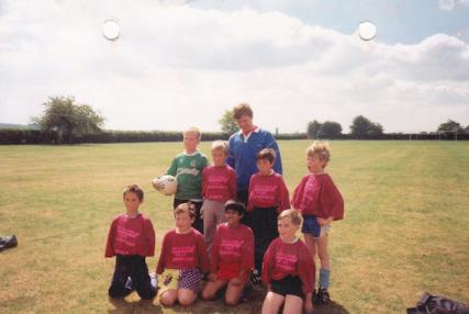 Football Tournament at Fawcett School, 44th Cambridge (Trumpington) Scout Group, Cubs c10 years old, c1990. Photo: at back: coach, Dave Betts; middle row: Martin Betts, ?, Glen Hopkins, Henry Greenhalgh; front row: ?, Mark Bentley, ?, Nick Dowell-McGrillan. Photo: Sheila Betts.