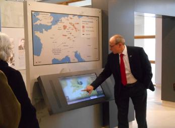 Arthur Brookes introducing the interpretive displays in the Visitor Center, Cambridge American Cemetery, Local History Group visit. Photo: Andrew Roberts, 1 March 2015.