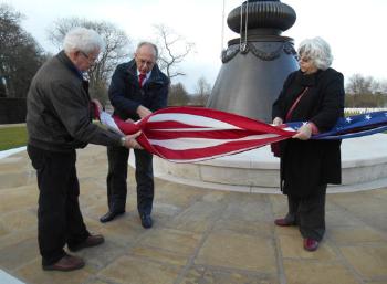 Martin Jones, Arthur Brookes and Sheila Glasswell folding the flag, Cambridge American Cemetery, Local History Group visit. Photo: Andrew Roberts, 1 March 2015.