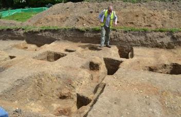 Richard Mortimer describing archaeological features, Anstey Hall Farm, 10 May 2015.