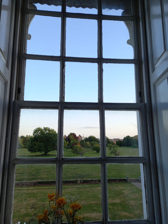View into the grounds of Anstey Hall, from a landing window. Photo: Andrew Roberts, 22 May 2025.