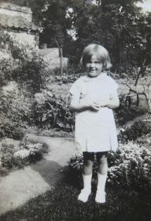 Audrey Rayner, age 6?, in the garden of the house in Church Lane. Source: Audrey King, copy photo by Howard Slatter, March 2017.