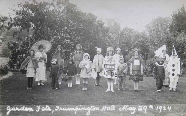 Garden Fete at Trumpington Hall, 29 May 1924. Fancy Dress with Eric King as a cat (3rd from the right) and Amy next to him (4th from right). Source: Audrey King, copy photo by Howard Slatter, March 2017.
