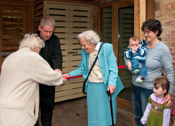 Opening of the Bakehouse, Trumpington Church, 3 October 2010. Jess Rattenbury and Mary Pitman cutting the ribbon, with Jonas and Rosie Moore and Rev. Andy Chrich. Photo: Stephen Brown.