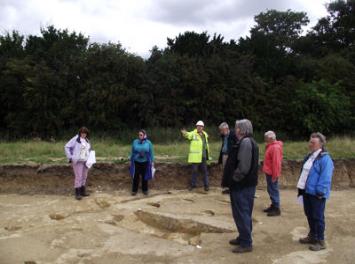 Looking at the Bell School archaeological site during the Local History Group visit. Photo: Randall Evans, 18 August 2014.