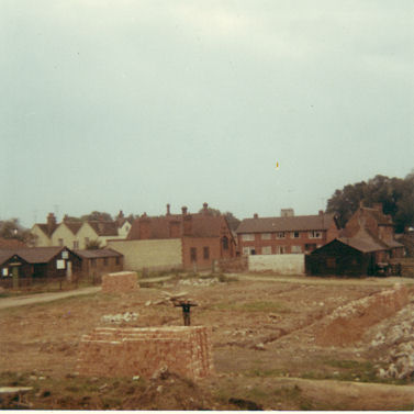 Construction work on the transformation of Manor Farm into Beverley Way, with the Village Hall and Scout huts to the left, 1968.