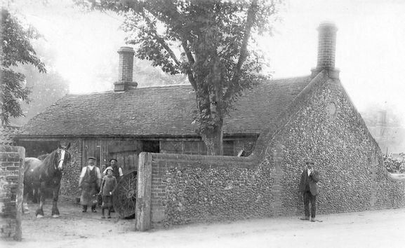 Blacksmith's workshop at the junction of the High Street and Church Lane, c. 1900, Cambridgeshire Collection.