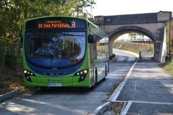 Services on the Busway through Trumpington, a bus in the cutting under Hauxton Road bridge, October 2011. Photos: Andrew Roberts.