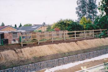 Erecting the boundary fence on the north side of the railway cutting, September-October 2010.