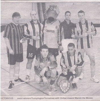 Victorious event winners Trumpington Tornadoes with United mascot Marvin the Moose. [Source: CEN, 4 January 2003, p.30]