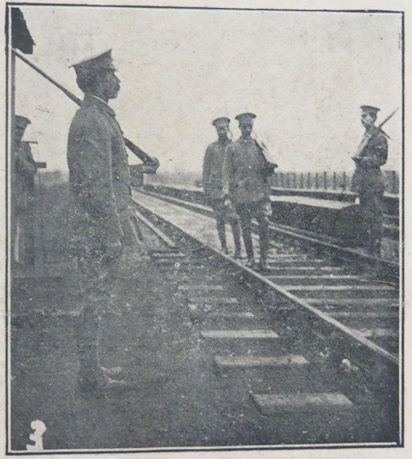 Members of the Trumpington V.T.C., Patrol No.3, on duty guarding a railway bridge "Somewhere in Cambs". Cambridge Chronicle.