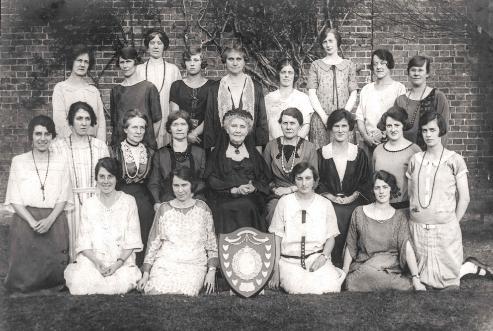 Trumpington Women's Institute chorus with an award at the Cambridgeshire Festival of Music, 1925, including Viola Pemberton (top row, fifth from left) and Patience Pemberton (middle row, fifth from left) (reproduced in Trumpington Past & Present, p. 118). (Trumpington WI, Stephen Brown).