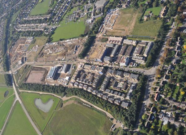 Aerial photograph of Clay Farm from the east, with Long Road to the right and Northrop Road above the junction and road into the Clay Farm development. Countryside/Tamdown, 8 September 2015.