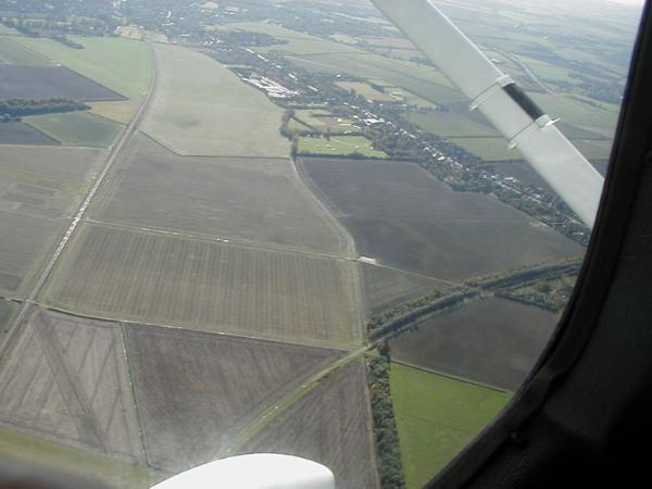 Aerial photograph of Clay Farm from the north, before the development of Addenbrooke's Road and housing, with the main railway line to the left, Shelford Road and the camp site upper right. Source: Howard Slatter.