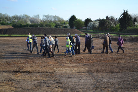 A group led by Tom Philipps walking onto the field to the rear of Foster Road. Photo: Andrew Roberts, 7 April 2011.