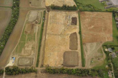 Near vertical aerial view of the archaeological excavation on Clay Farm looking at the fields to the south of Long Road. Source: Oxford Archaeology East, 13 April 2011.