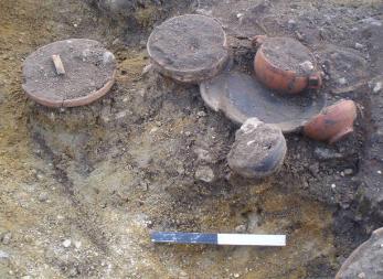 Finds in situ in the cremation pit, Clay Farm. Oxford Archaeology East, 2011.