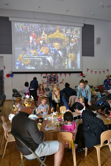 Crafts and games in the hall during the Coronation, Clay Farm Centre. Photo: Andrew Roberts, 6 May 2023.