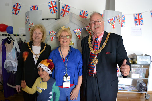 The Mayor and Mayoress, Councillor Mark Ashton and Barbara Ashton, with Alison Woods and residents at the Coronation photobooth, Clay Farm Centre. Photo: Andrew Roberts, 6 May 2023.