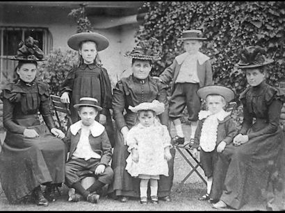 Mrs Elizabeth Matthews and her family, c. 1900: Agnes, mother and William to rear; Elizabeth, Charles, Ellen, Harry and Sarah to front. Photograph reproduced in Trumpington in Old Picture Postcards, 63. Source: Charlie Matthews and Nellie Burbridge (née Matthews), Stephen Brown.