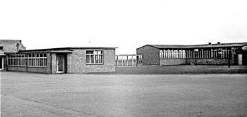 Fawcett School, exterior buildings and playground, 1950s. Photograph: Cambridgeshire Collection, Cambridge Central Library.