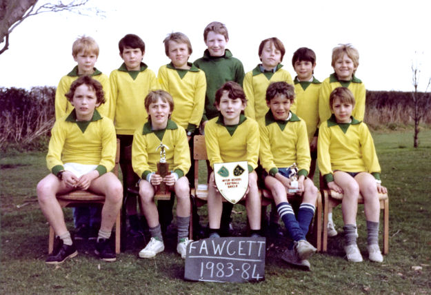 The victorious football team at Fawcett School, 1983-84. Inter-School Football Shield. Back row: (from left to right) Patrick Adams, Shane Smith, Barry ?, Jason Powell, Martin Flint, Damian Brown, Richard Harvey; front row: Richard Orvis, Chris Johnson, Robert Hesketh, Ben Rosavere, ? Photo from Damian Brown (Trumpington Past & Present, page 105).