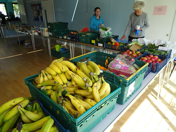 Fruit and volunteers at Trumpington Food Hub. Photo: Andrew Roberts, 26 May 2023.