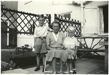 My mother, younger brother and I on the patio outside the dining room window of 165 Foster Road in 1952/3. Source: Colin Gedge.