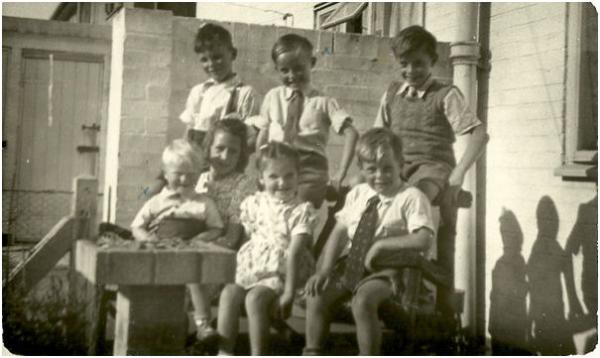 Friends on the back garden patio of 165 Foster Road in 1951/2. Back row left to right: Graham Aylett; Colin Gedge (author); Graham Stepney. Front row left to right: Geoffrey Gedge; Lena Nugent; Carol Nugent; Keith Aylett. Source: Colin Gedge.