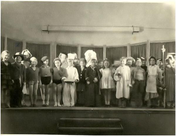 Cast of an unknown play in Fawcett Junior School in 1952/3, author seen as �Little old man�, 2nd from left, other members of the cast unknown. Source: Colin Gedge.