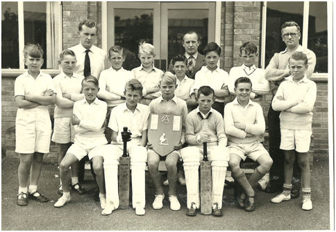 Fawcett Junior School Cricket Team in 1958/9. Back row centre: Mr F N Walker (Headmaster); Right; Mr Jenkins? Front row: 1st from left, Geoffrey Gedge; 4th from left;? Aves? Others unknown. Source: Colin Gedge.