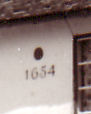 Dated Cottages, 18 Grantchester Road, showing the Sun-Fire Insurance Company plaque and the 1654 date