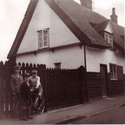 Park Cottage, 22 Grantchester Road, 13 July 1957, from Grantchester Road. With Brian Goodliffe, rear left (aged 13), Michael Goodliffe, front (aged 7) and one of the Parr family. Photo: Goodliffe family.