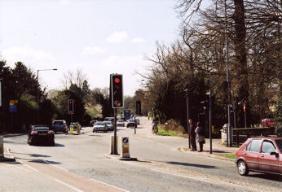 The current junction of Trumpington Road and Brooklands Avenue, with the milestone and rebuilt bridge, March 2009.
