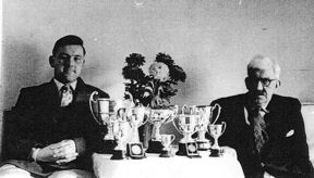 Michael Collins and his father, Harry Collins, with their cups, 1956.