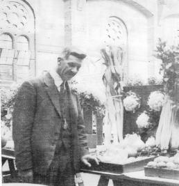 Harry Collins - annual winner of the Forbes Trophy with the highest number of points at the Trumpington Horticultural Show for the ten-year period 1946-1955. Photo taken in the Corn Exchange in the 1920s.