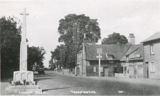 The High Street with the War Memorial and Red Lion, 1920s-30s. Cambridgeshire Collection.