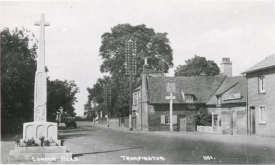 The High Street with the War Memorial and Red Lion and Lime Cottage, 1920s-30s. Cambridgeshire Collection. 