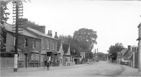 Harveys Stores and Holmlea Laundry, looking south along the High Street, 1920s. Cambridgeshire Collection.