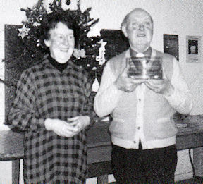 Reverend David Maddox and Lucy Maddox, with David being presented with a gift by the Trumpington Tuesday Group on his retirement as Vicar, 1990. Photo: Sylvia Jones.