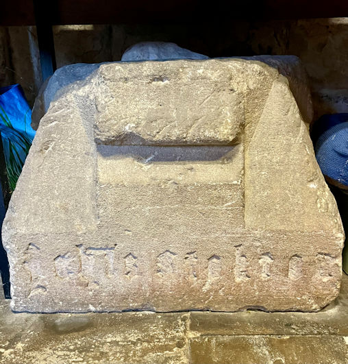 The base of the former village cross, with inscription to John Stokton, now in Trumpington Parish Church. Photo: Jo Sear, 2023.