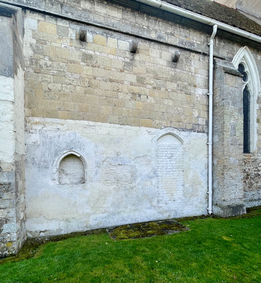 Evidence of a possible anchorite cell on the outside of the northern wall of the chancel, Trumpington Parish Church. Photo: Jo Sear, 2023.]