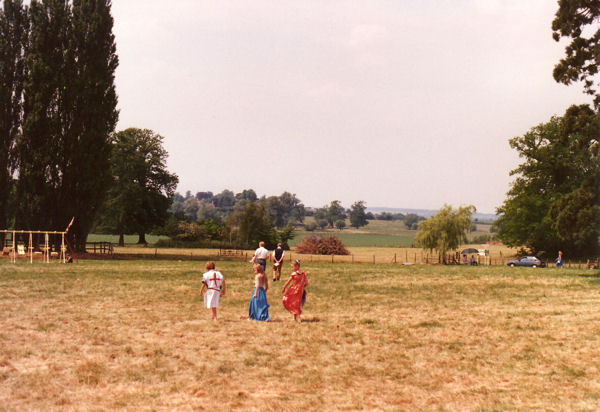 Children in Medieval dress in the grounds of Trumpington Hall, with Grantchester in the distance, Trumpington Medieval Weekend, 16-18 June 1989