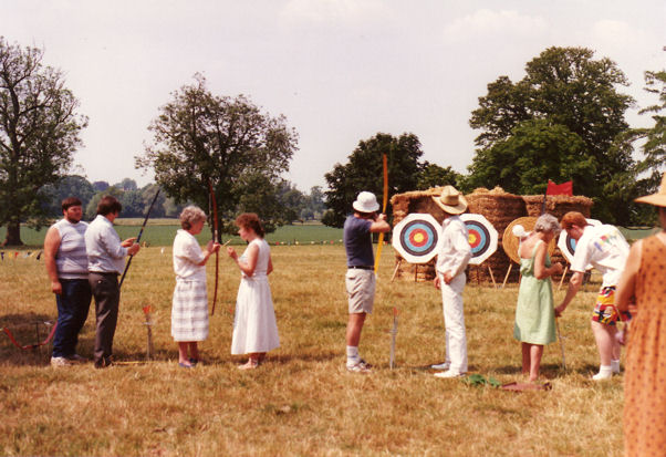Trying our hand as archers in the grounds of Trumpington Hall, Trumpington Medieval Weekend, 16-18 June 1989