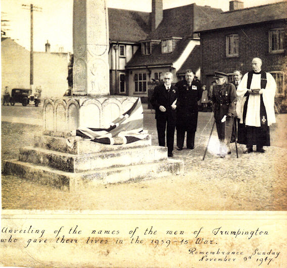 Unveiling of the new inscription on the Trumpington War Memorial by Major E. Saville Peck, D.L. (Cambridgeshire Regt. T.), with Rev. T. Young to his left, 9 November 1947. Newell Family collection.