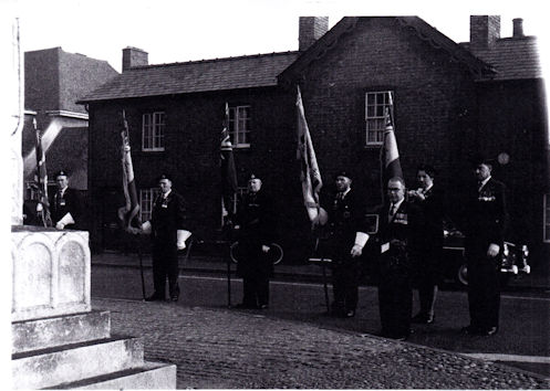 Remembrance Day, c. 1967. British Legion Chairman, Stanley Newell, laying a wreath at the War Memorial on Remembrance Day. Newell Family collection.