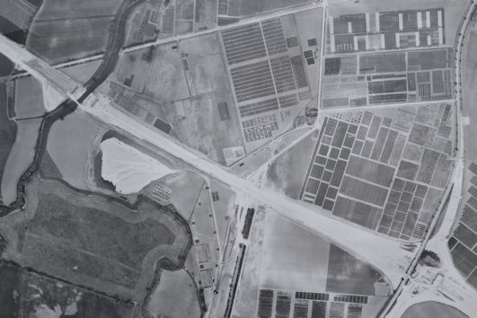 Aerial photograph of the Plant Breeding Institute (PBI) site, 1978: detail of M11 construction and the spoil being spread near the river. Source: Michael Hendy.