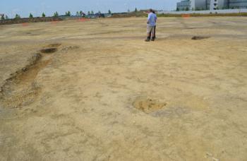 Richard Mortimer and Tom Phillips at the Papworth archaeological site. Photo: Andrew Roberts, 25 July 2014.