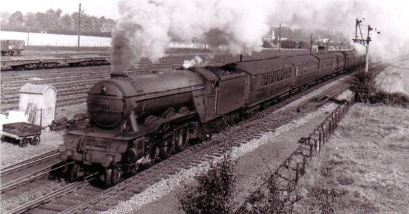 Up Kings Cross Express passing Long Road Bridge hauled by Gresley A3 Pacific on a running in turn from Kings Cross Top Shed. Source: Edmund Brookes.